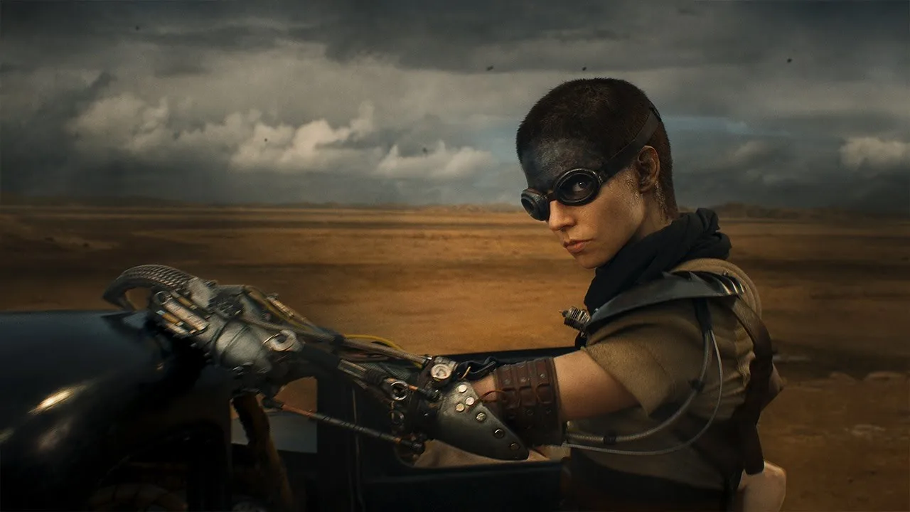Woman on motorcycle in dystopian desert landscape with stormy skies.