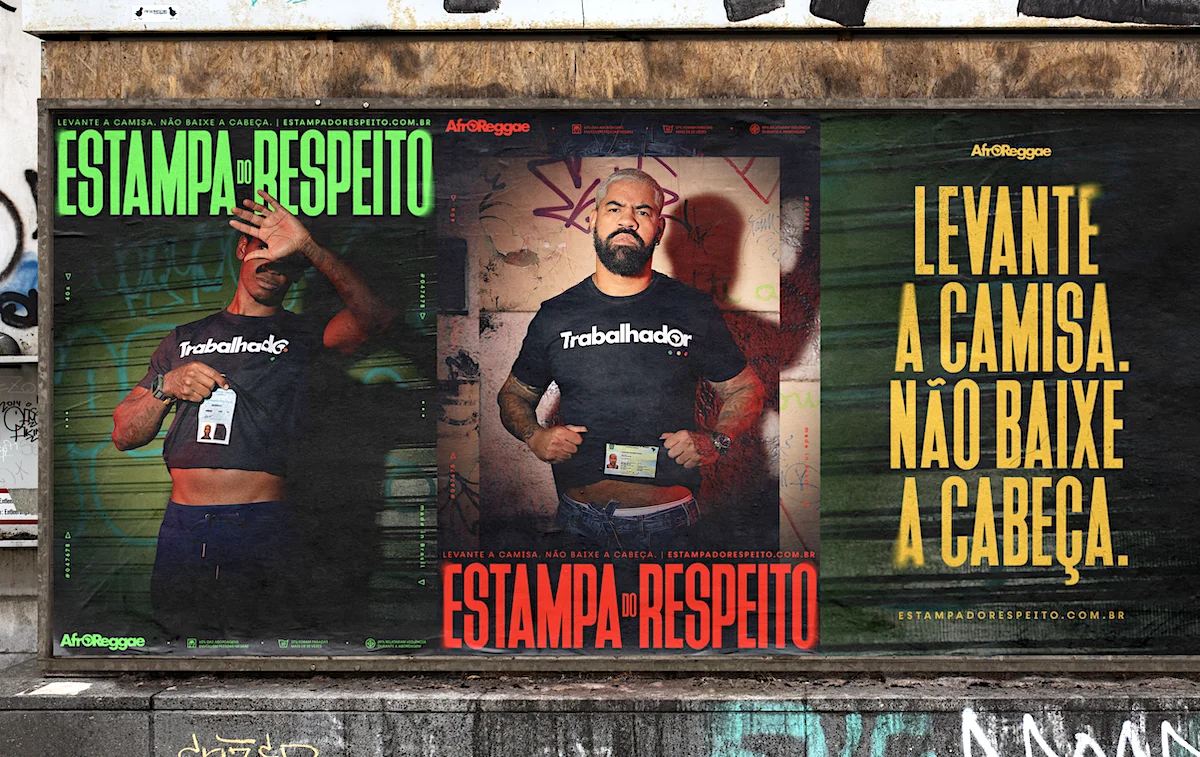 Street posters promoting AfroReggae's "Estampa do Respeito" campaign, featuring individuals lifting their shirts to reveal ID badges, with the message "Levante a camisa. Não baixe a cabeça."