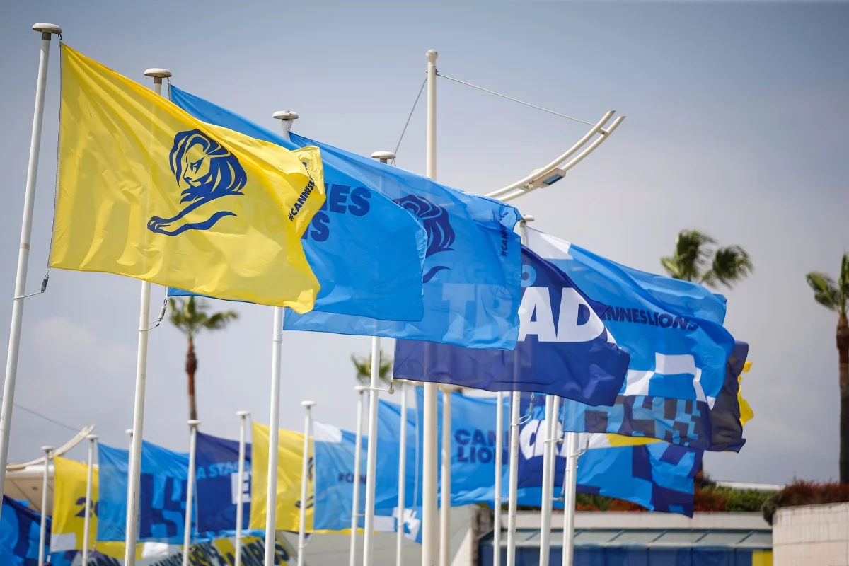 Colorful flags waving at Cannes Lions International Festival of Creativity.