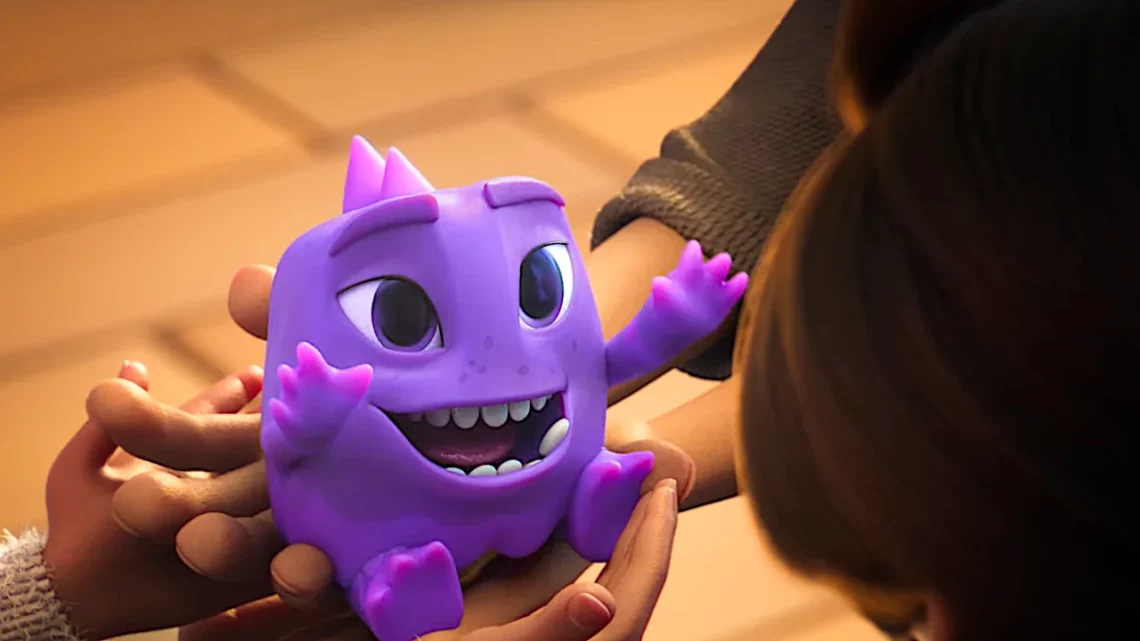 Nubank Ultravioleta Lança Curta 'Não É Um Monstro' com Disney. Animated purple creature with big eyes and a wide smile being held by a person.