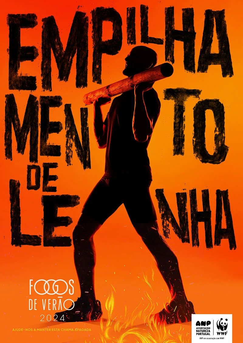 Silhouette of a person carrying firewood with text "Empilhamento de Lenha" on a fiery orange background, promoting "Fogos de Verão 2024" by ANP and WWF.