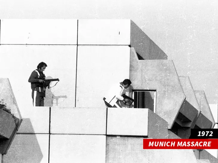 1972 Munich Massacre, armed individuals on building rooftop during the Olympic Games hostage crisis.