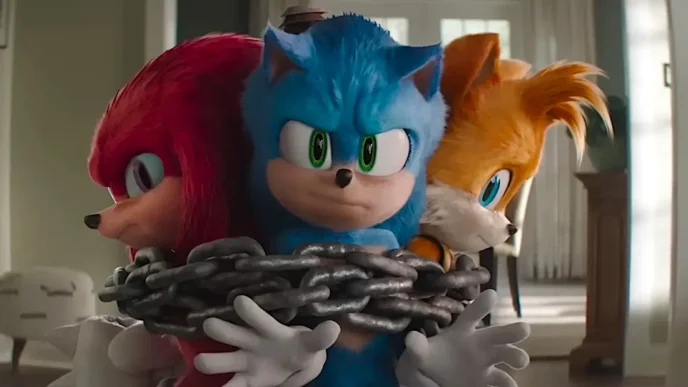 Personagens Sonic, Knuckles e Tails acorrentados juntos.