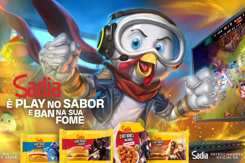 Mascote Sadia com lanches, videogame ao fundo.