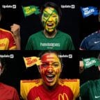 Torcedores com pinturas faciais de marcas famosas